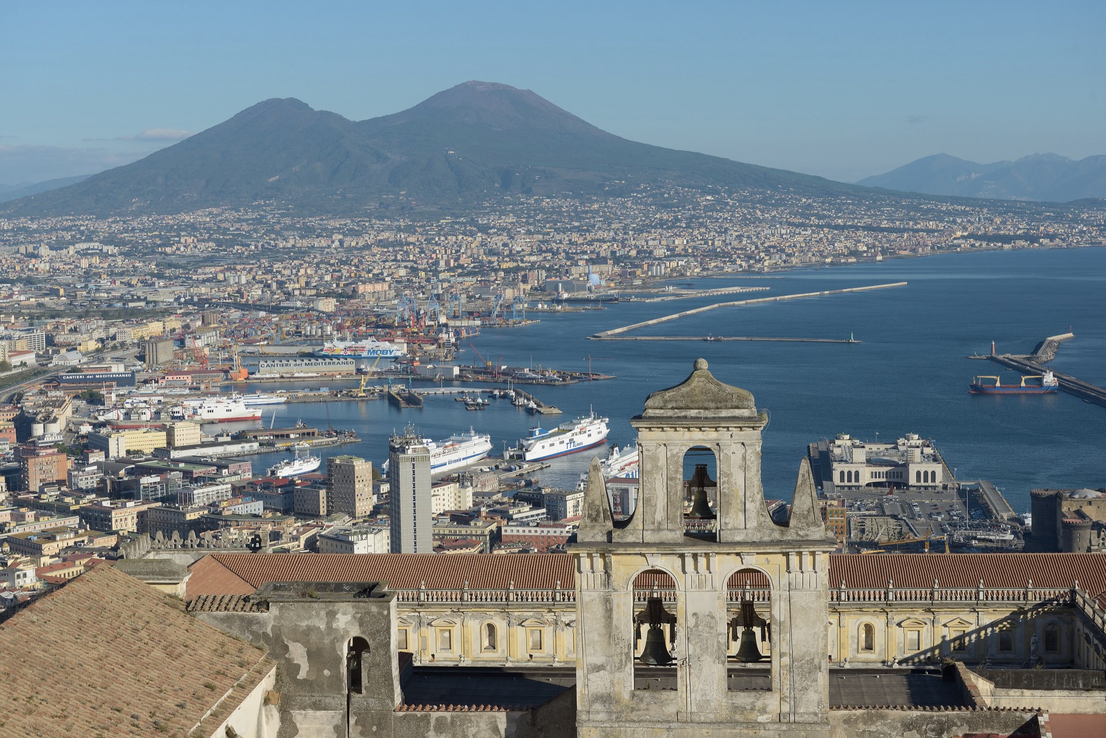 The Bay of Naples and Vesuvius, seen from above the city with the bell tower of San Martino in front